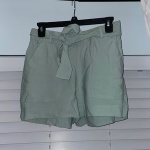 A new day shorts with tie in the front, size XS.